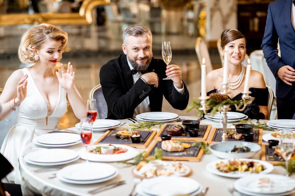 elegantly-dressed-people-having-a-festive-dinner-i-2026-01-09-06-45-46-utc-1.jpg
