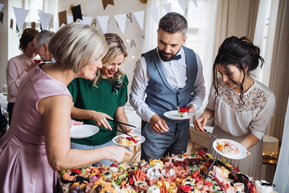 multigeneration-family-putting-food-on-plates-on-a-2026-01-05-06-16-24-utc-1.jpg